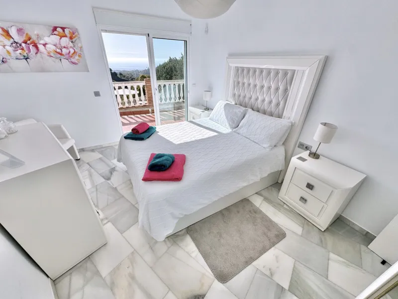 New Listing - Lovely 5 bed, 3.5 bath Villa on elevated plot in Upper Calahonda, offering beautiful panoramic views over tree-lined hillside down to the sea.