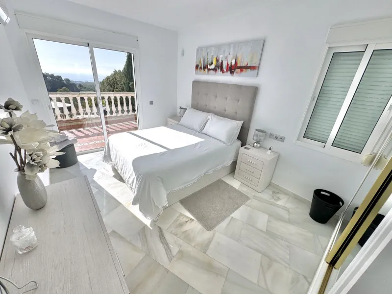 New Listing - Lovely 5 bed, 3.5 bath Villa on elevated plot in Upper Calahonda, offering beautiful panoramic views over tree-lined hillside down to the sea.