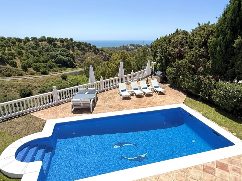 New Listing - Lovely 5 bed, 3.5 bath Villa on elevated plot in Upper Calahonda, offering beautiful panoramic views over tree-lined hillside down to the sea.