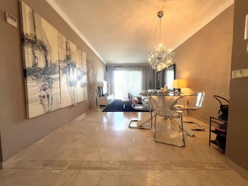 Introducing a beautifully upgraded 2-bedroom, 2-bathroom residence in the exclusive Terrazas de Banús, one of Puerto Banús' most sought-after complexes. Offering 24-hour concierge service, pristine subtropical gardens, and two serene swimming pools, this 