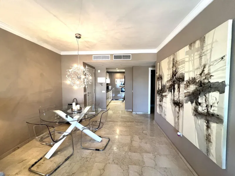 Introducing a beautifully upgraded 2-bedroom, 2-bathroom residence in the exclusive Terrazas de Banús, one of Puerto Banús' most sought-after complexes. Offering 24-hour concierge service, pristine subtropical gardens, and two serene swimming pools, this 