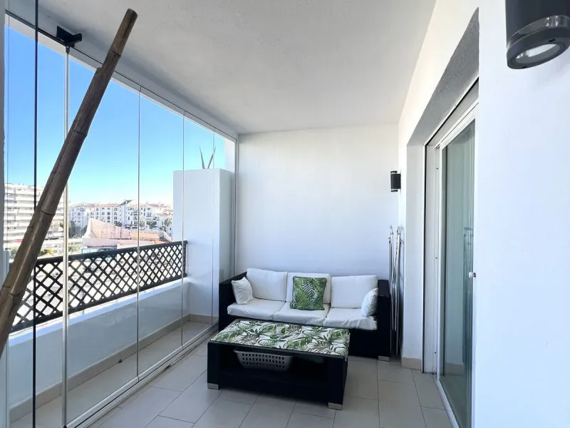 Introducing a beautifully upgraded 2-bedroom, 2-bathroom residence in the exclusive Terrazas de Banús, one of Puerto Banús' most sought-after complexes. Offering 24-hour concierge service, pristine subtropical gardens, and two serene swimming pools, this 