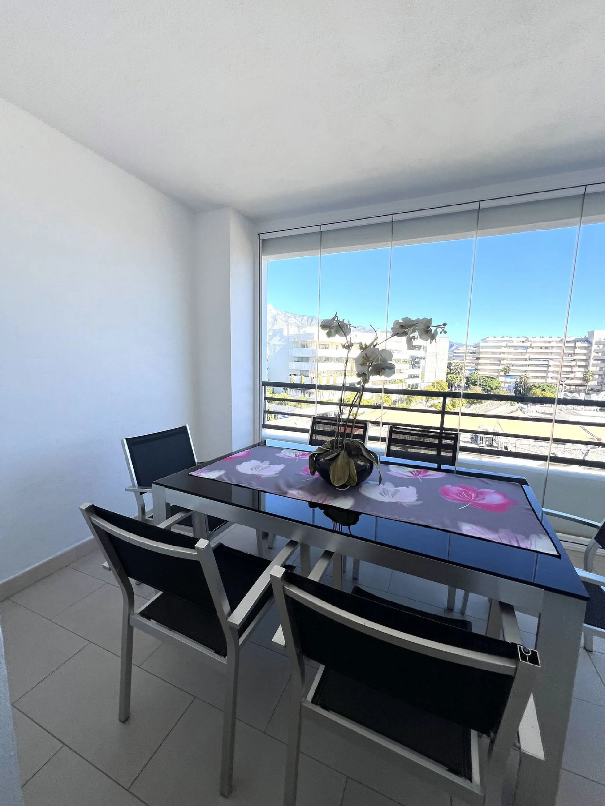 Introducing a beautifully upgraded 2-bedroom, 2-bathroom residence in the exclusive Terrazas de Banús, one of Puerto Banús' most sought-after complexes. Offering 24-hour concierge service, pristine subtropical gardens, and two serene swimming pools, this 