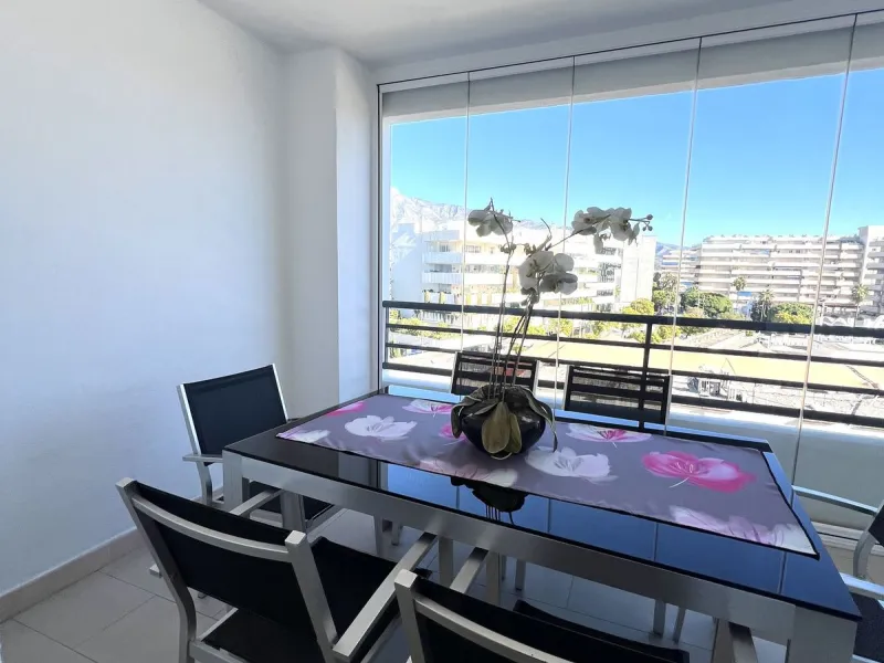 Introducing a beautifully upgraded 2-bedroom, 2-bathroom residence in the exclusive Terrazas de Banús, one of Puerto Banús' most sought-after complexes. Offering 24-hour concierge service, pristine subtropical gardens, and two serene swimming pools, this 