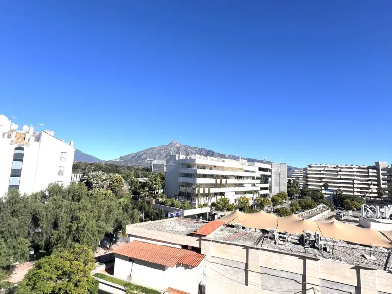 Introducing a beautifully upgraded 2-bedroom, 2-bathroom residence in the exclusive Terrazas de Banús, one of Puerto Banús' most sought-after complexes. Offering 24-hour concierge service, pristine subtropical gardens, and two serene swimming pools, this 