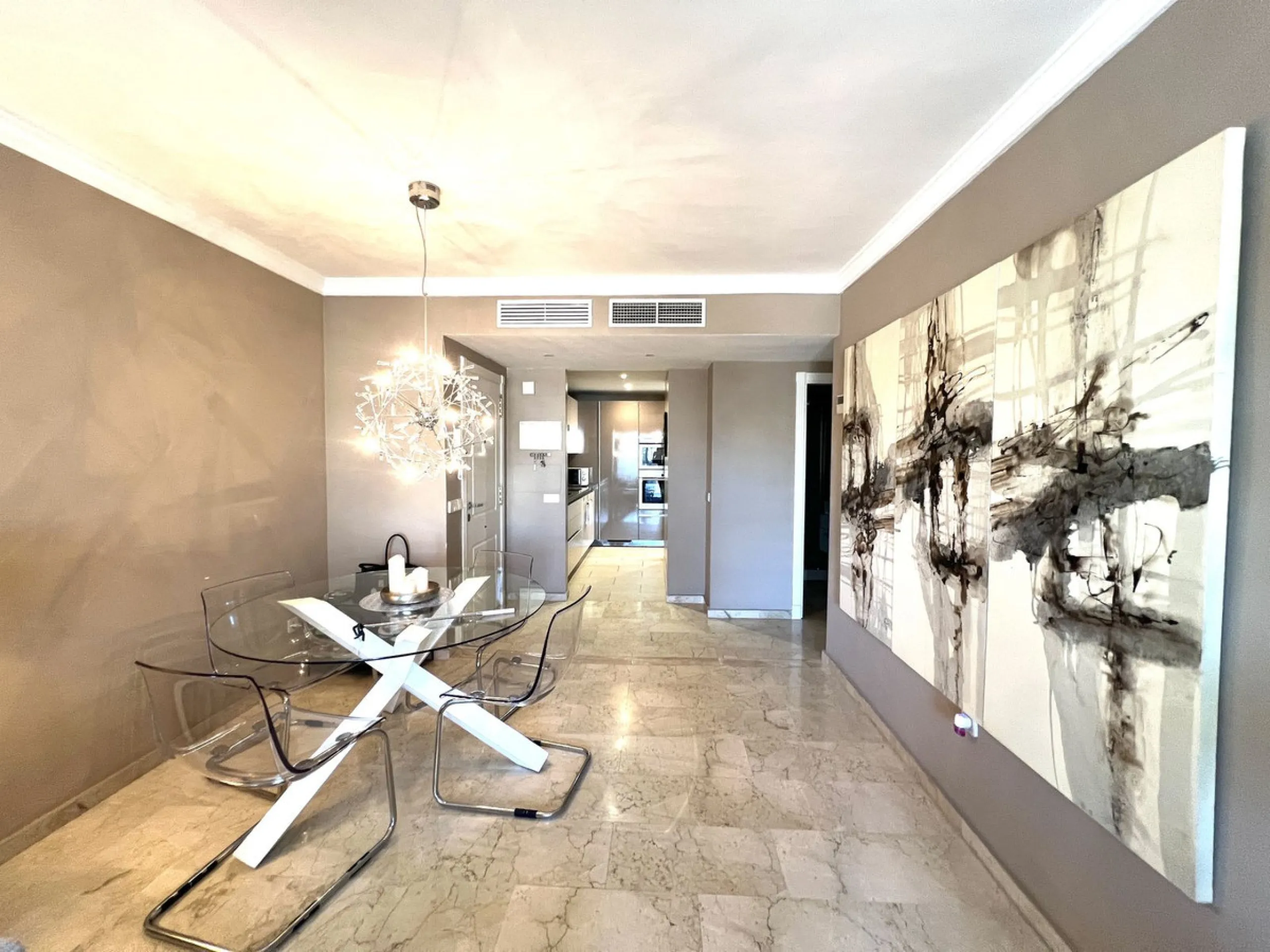 Introducing a beautifully upgraded 2-bedroom, 2-bathroom residence in the exclusive Terrazas de Banús, one of Puerto Banús' most sought-after complexes. Offering 24-hour concierge service, pristine subtropical gardens, and two serene swimming pools, this 