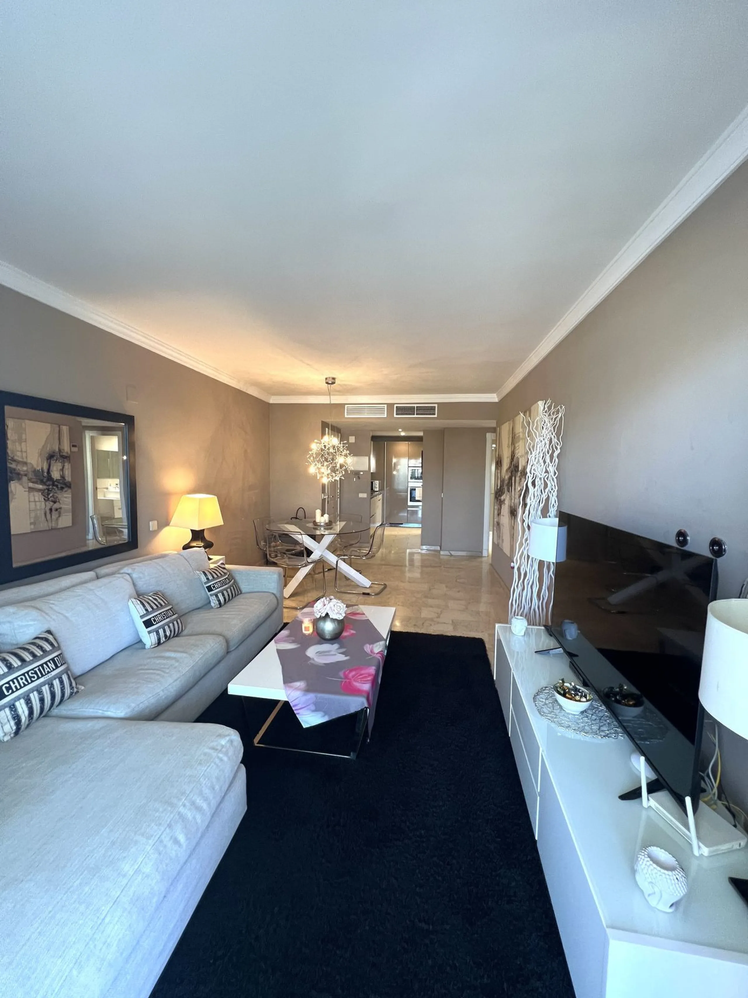 Introducing a beautifully upgraded 2-bedroom, 2-bathroom residence in the exclusive Terrazas de Banús, one of Puerto Banús' most sought-after complexes. Offering 24-hour concierge service, pristine subtropical gardens, and two serene swimming pools, this 
