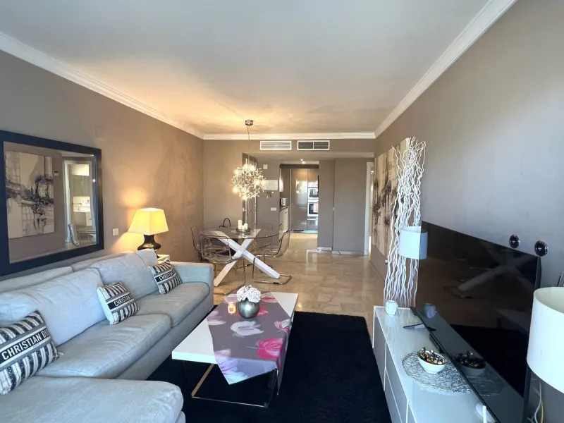 Introducing a beautifully upgraded 2-bedroom, 2-bathroom residence in the exclusive Terrazas de Banús, one of Puerto Banús' most sought-after complexes. Offering 24-hour concierge service, pristine subtropical gardens, and two serene swimming pools, this 