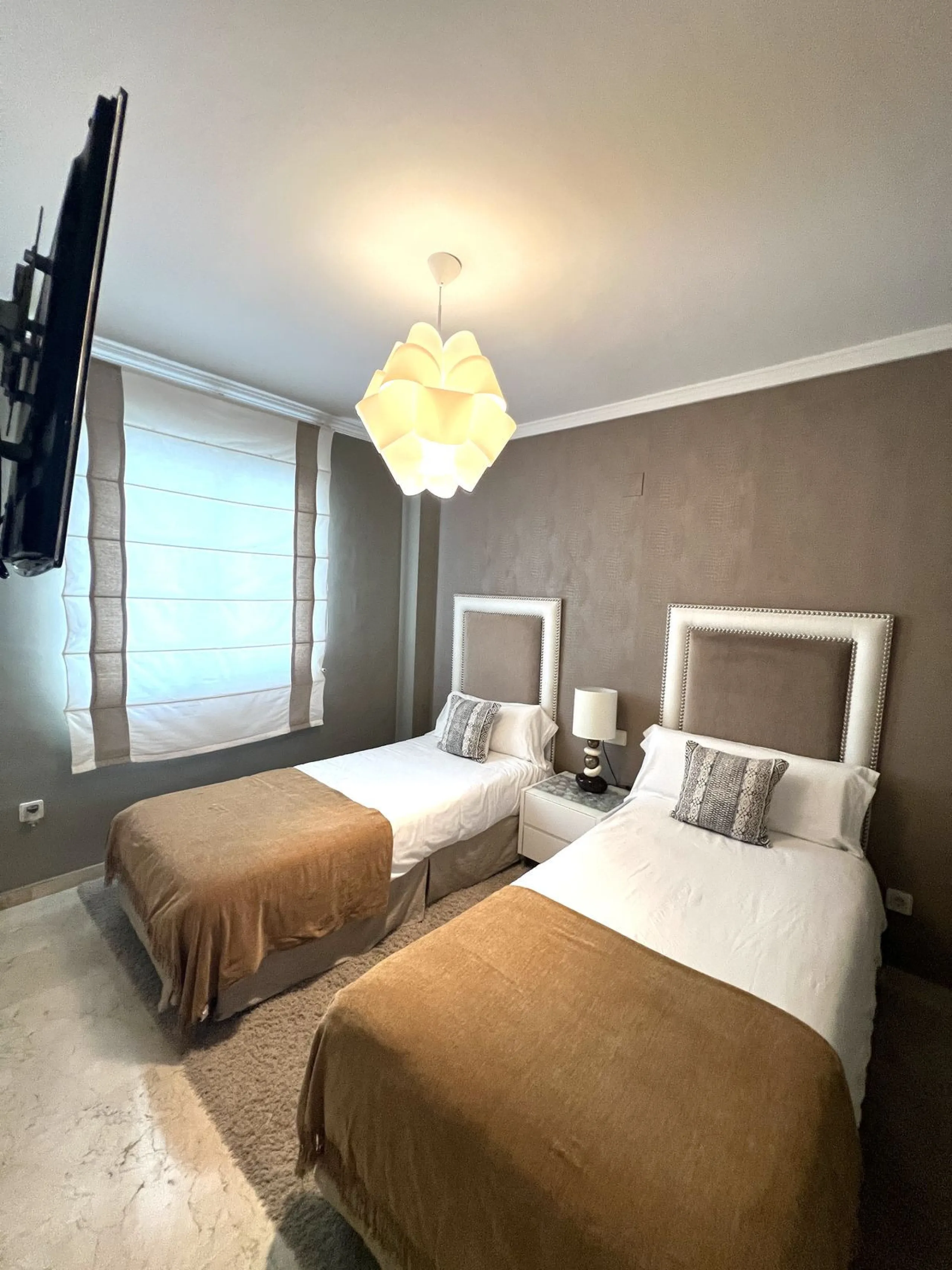 Introducing a beautifully upgraded 2-bedroom, 2-bathroom residence in the exclusive Terrazas de Banús, one of Puerto Banús' most sought-after complexes. Offering 24-hour concierge service, pristine subtropical gardens, and two serene swimming pools, this 