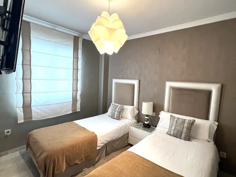 Introducing a beautifully upgraded 2-bedroom, 2-bathroom residence in the exclusive Terrazas de Banús, one of Puerto Banús' most sought-after complexes. Offering 24-hour concierge service, pristine subtropical gardens, and two serene swimming pools, this 