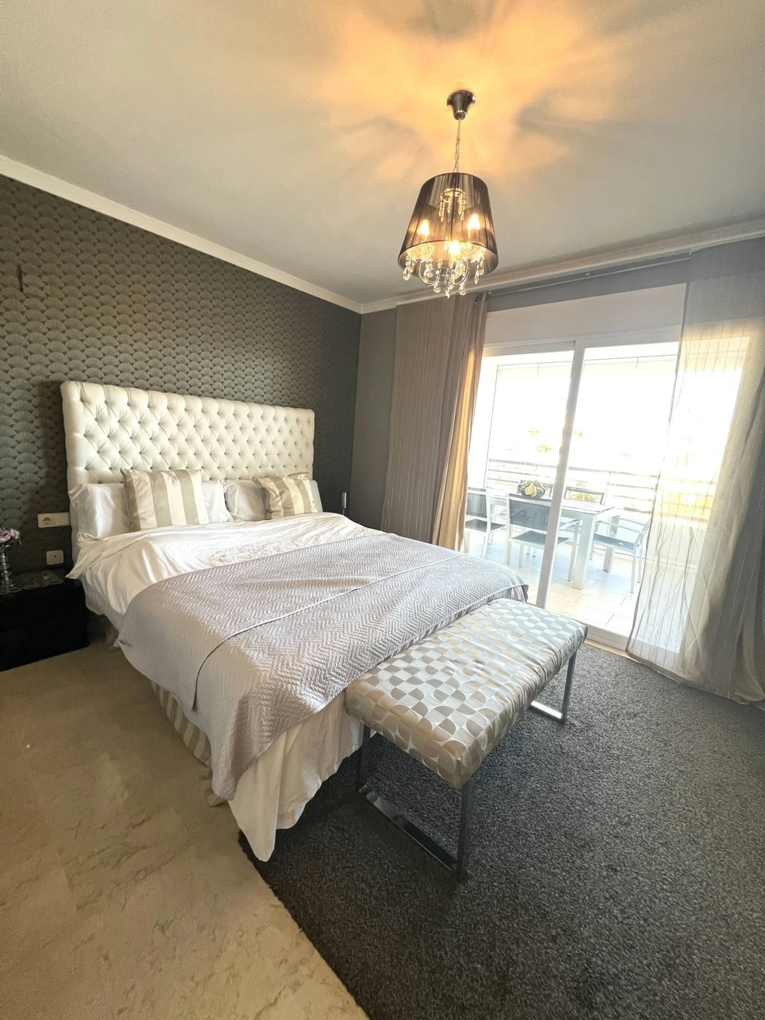 Introducing a beautifully upgraded 2-bedroom, 2-bathroom residence in the exclusive Terrazas de Banús, one of Puerto Banús' most sought-after complexes. Offering 24-hour concierge service, pristine subtropical gardens, and two serene swimming pools, this 