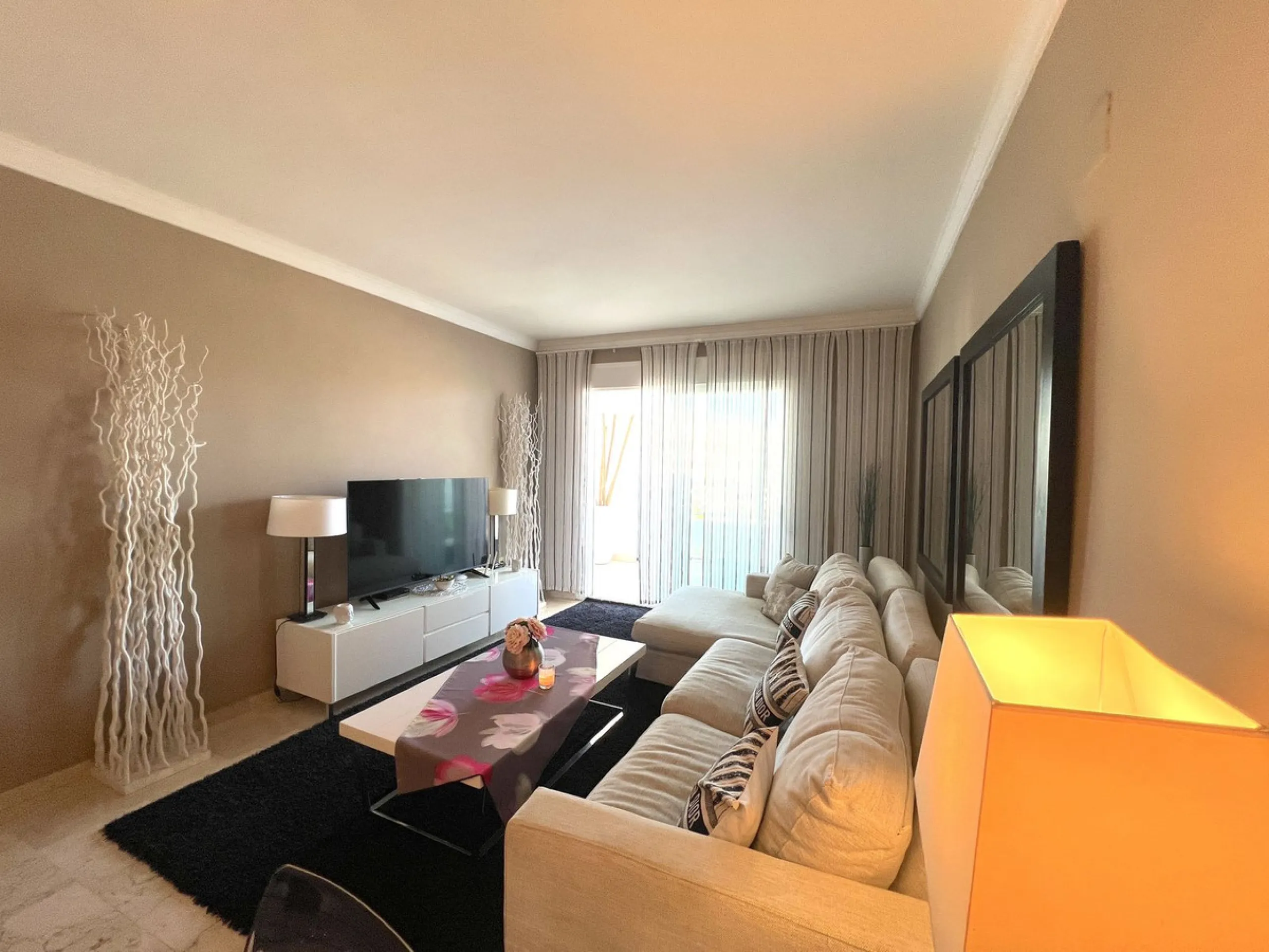 Introducing a beautifully upgraded 2-bedroom, 2-bathroom residence in the exclusive Terrazas de Banús, one of Puerto Banús' most sought-after complexes. Offering 24-hour concierge service, pristine subtropical gardens, and two serene swimming pools, this 