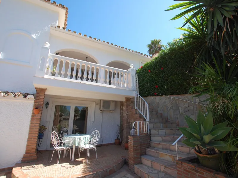 A large villa  in a quiet cul de sac in the Urbanisation of Campo Mijas with a large walled and gated garden with ample parking space for 3 or 4 cars . The property is entered via a gated entrance way to the large parking area with easy access to  the hou