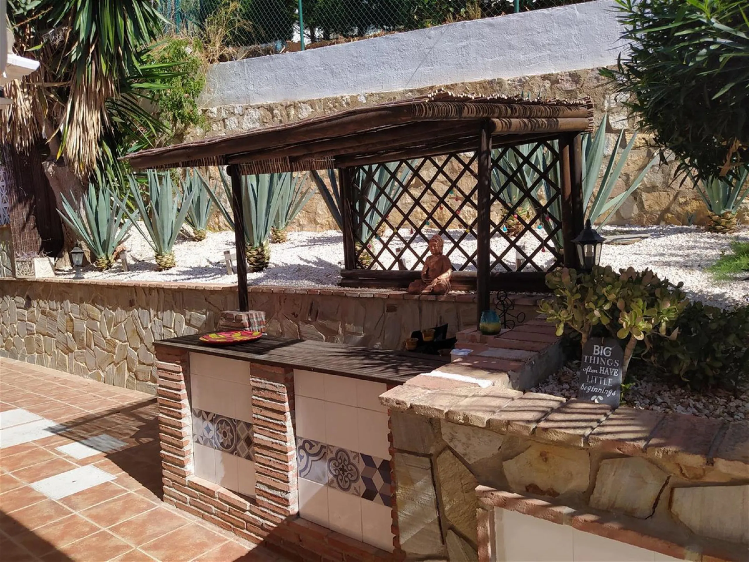 A large villa  in a quiet cul de sac in the Urbanisation of Campo Mijas with a large walled and gated garden with ample parking space for 3 or 4 cars . The property is entered via a gated entrance way to the large parking area with easy access to  the hou