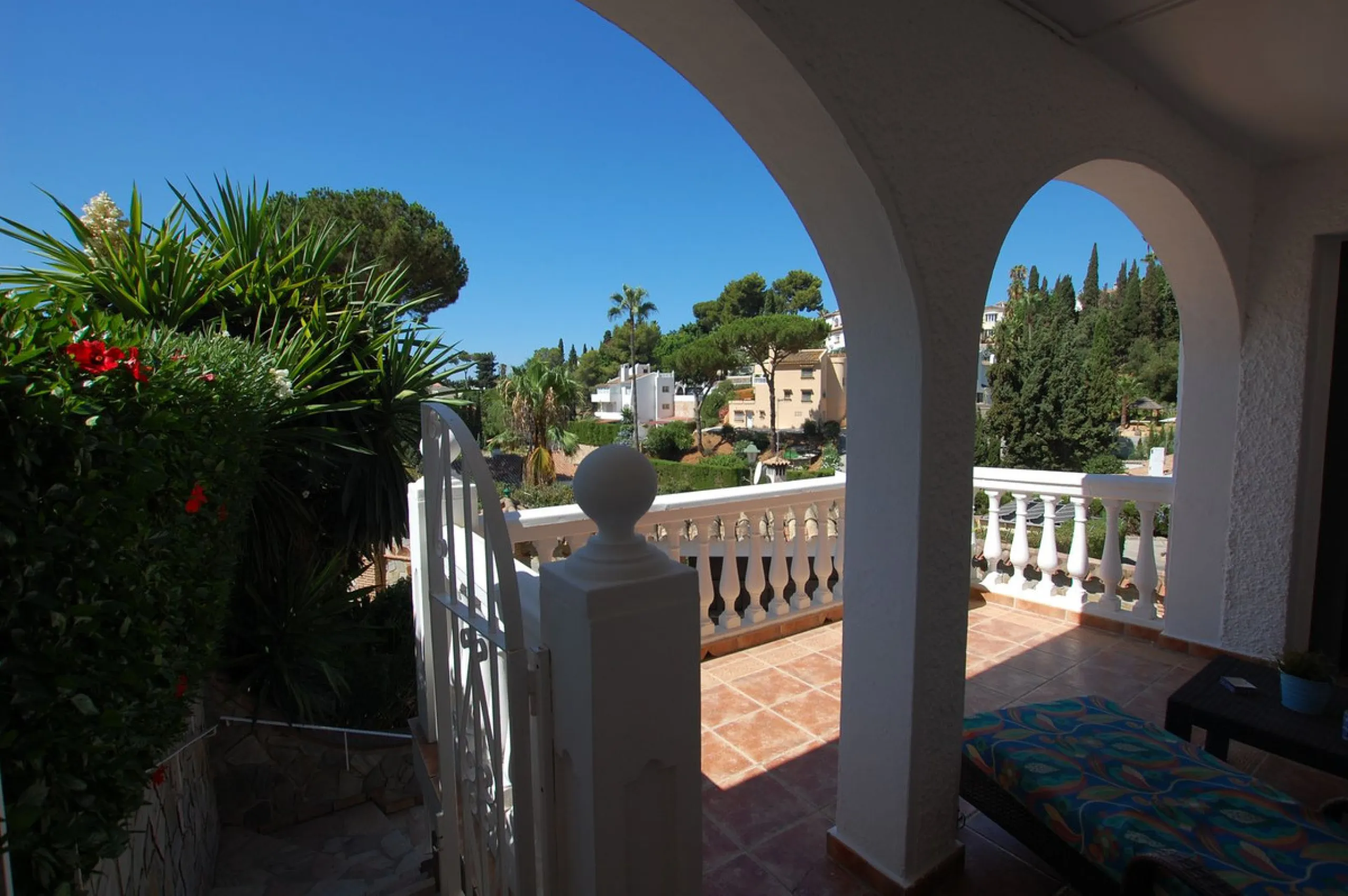 A large villa  in a quiet cul de sac in the Urbanisation of Campo Mijas with a large walled and gated garden with ample parking space for 3 or 4 cars . The property is entered via a gated entrance way to the large parking area with easy access to  the hou