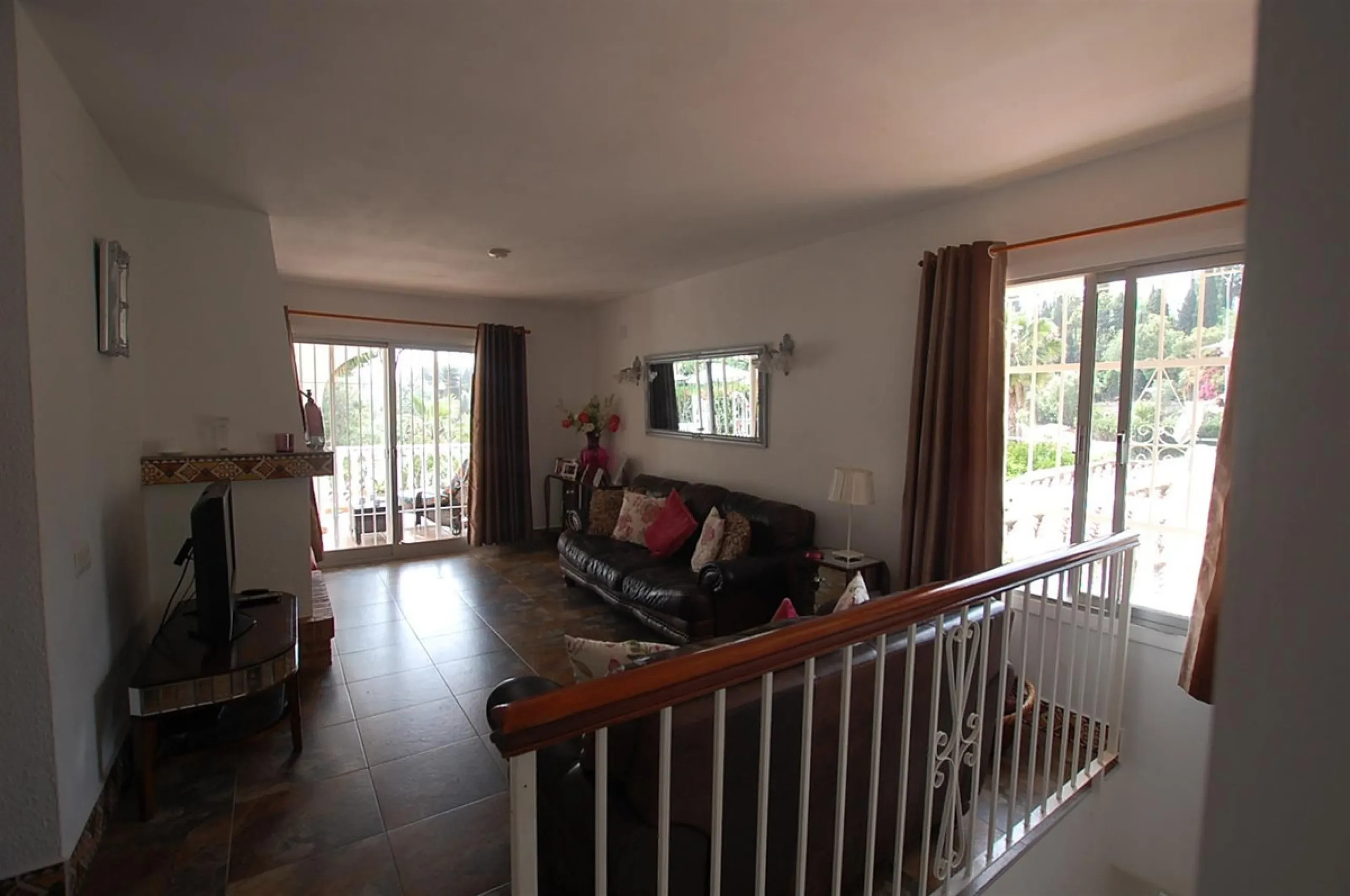 A large villa  in a quiet cul de sac in the Urbanisation of Campo Mijas with a large walled and gated garden with ample parking space for 3 or 4 cars . The property is entered via a gated entrance way to the large parking area with easy access to  the hou