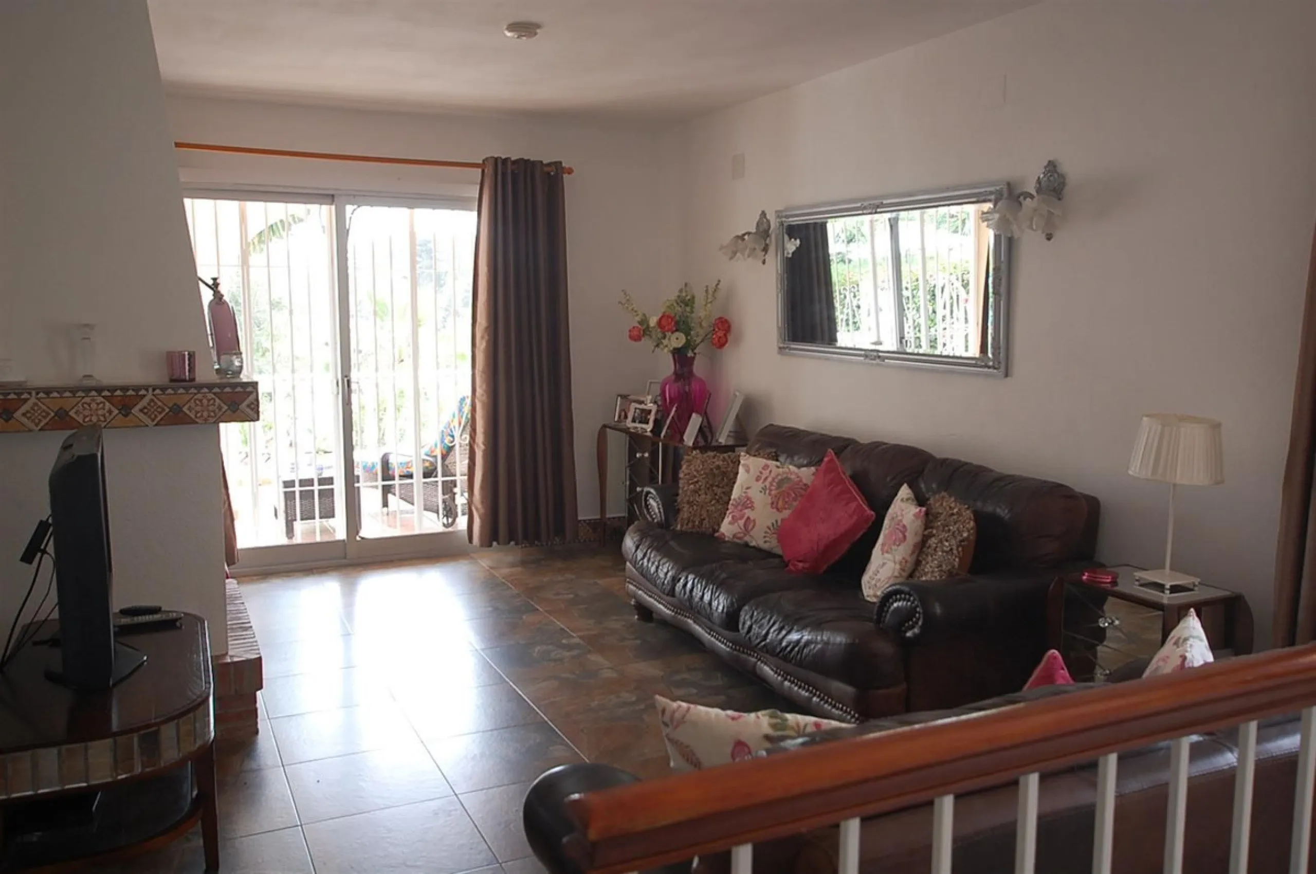 A large villa  in a quiet cul de sac in the Urbanisation of Campo Mijas with a large walled and gated garden with ample parking space for 3 or 4 cars . The property is entered via a gated entrance way to the large parking area with easy access to  the hou
