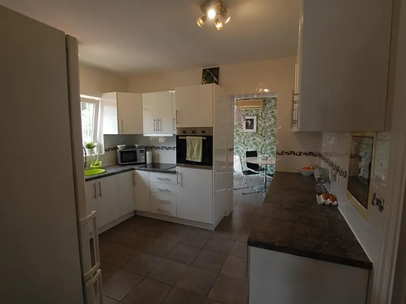 A large villa  in a quiet cul de sac in the Urbanisation of Campo Mijas with a large walled and gated garden with ample parking space for 3 or 4 cars . The property is entered via a gated entrance way to the large parking area with easy access to  the hou