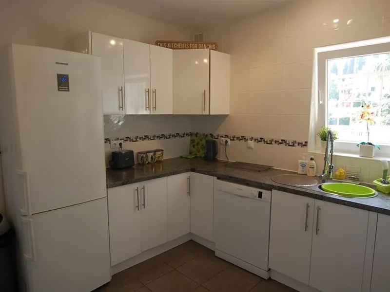 A large villa  in a quiet cul de sac in the Urbanisation of Campo Mijas with a large walled and gated garden with ample parking space for 3 or 4 cars . The property is entered via a gated entrance way to the large parking area with easy access to  the hou