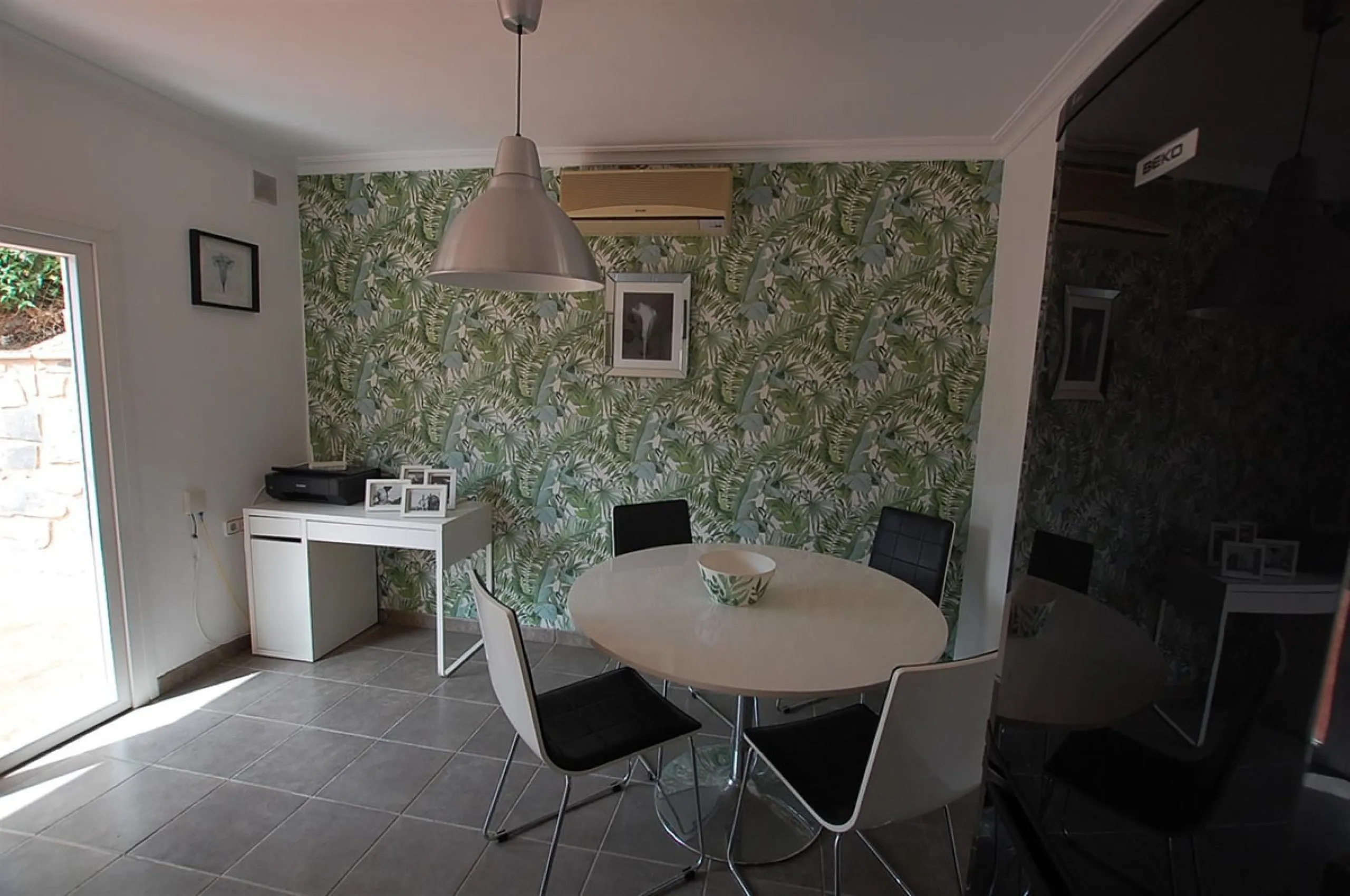 A large villa  in a quiet cul de sac in the Urbanisation of Campo Mijas with a large walled and gated garden with ample parking space for 3 or 4 cars . The property is entered via a gated entrance way to the large parking area with easy access to  the hou