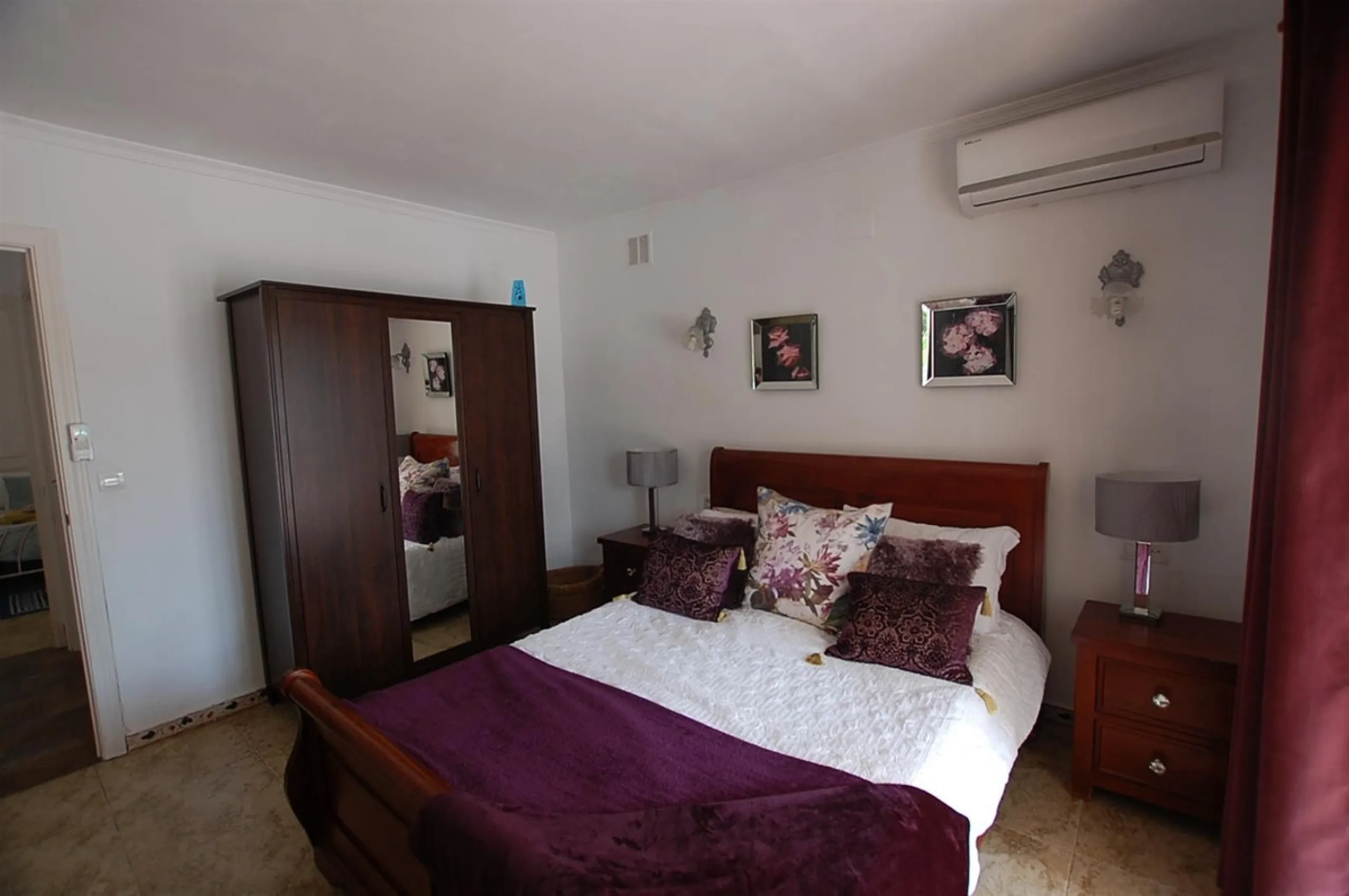 A large villa  in a quiet cul de sac in the Urbanisation of Campo Mijas with a large walled and gated garden with ample parking space for 3 or 4 cars . The property is entered via a gated entrance way to the large parking area with easy access to  the hou