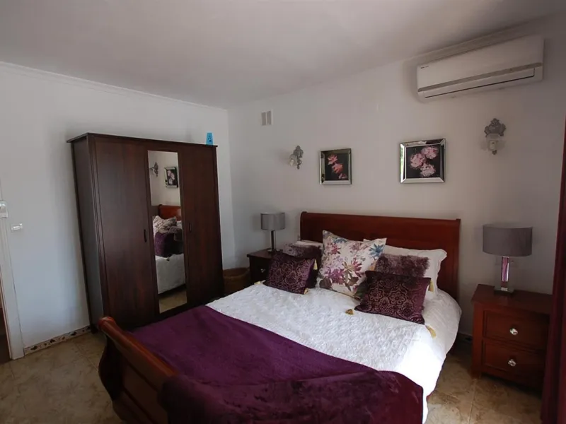 A large villa  in a quiet cul de sac in the Urbanisation of Campo Mijas with a large walled and gated garden with ample parking space for 3 or 4 cars . The property is entered via a gated entrance way to the large parking area with easy access to  the hou