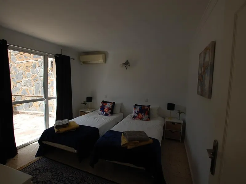 A large villa  in a quiet cul de sac in the Urbanisation of Campo Mijas with a large walled and gated garden with ample parking space for 3 or 4 cars . The property is entered via a gated entrance way to the large parking area with easy access to  the hou