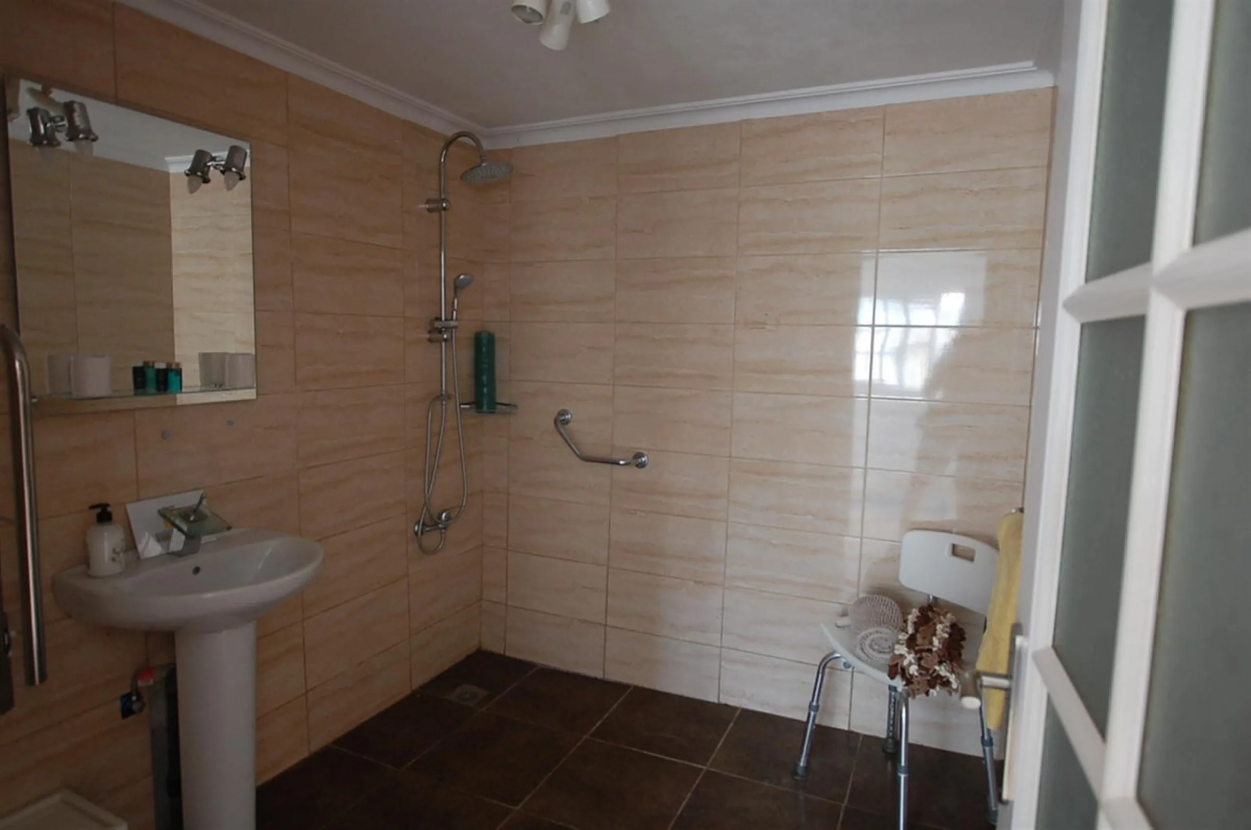 A large villa  in a quiet cul de sac in the Urbanisation of Campo Mijas with a large walled and gated garden with ample parking space for 3 or 4 cars . The property is entered via a gated entrance way to the large parking area with easy access to  the hou