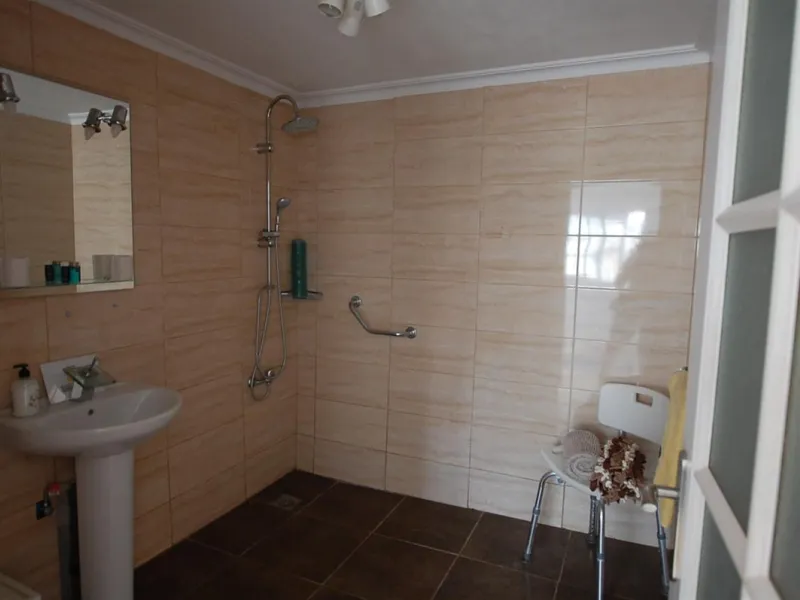 A large villa  in a quiet cul de sac in the Urbanisation of Campo Mijas with a large walled and gated garden with ample parking space for 3 or 4 cars . The property is entered via a gated entrance way to the large parking area with easy access to  the hou