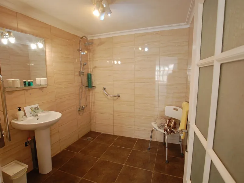 A large villa  in a quiet cul de sac in the Urbanisation of Campo Mijas with a large walled and gated garden with ample parking space for 3 or 4 cars . The property is entered via a gated entrance way to the large parking area with easy access to  the hou