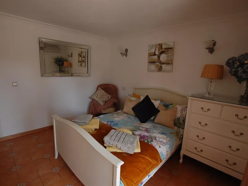 A large villa  in a quiet cul de sac in the Urbanisation of Campo Mijas with a large walled and gated garden with ample parking space for 3 or 4 cars . The property is entered via a gated entrance way to the large parking area with easy access to  the hou