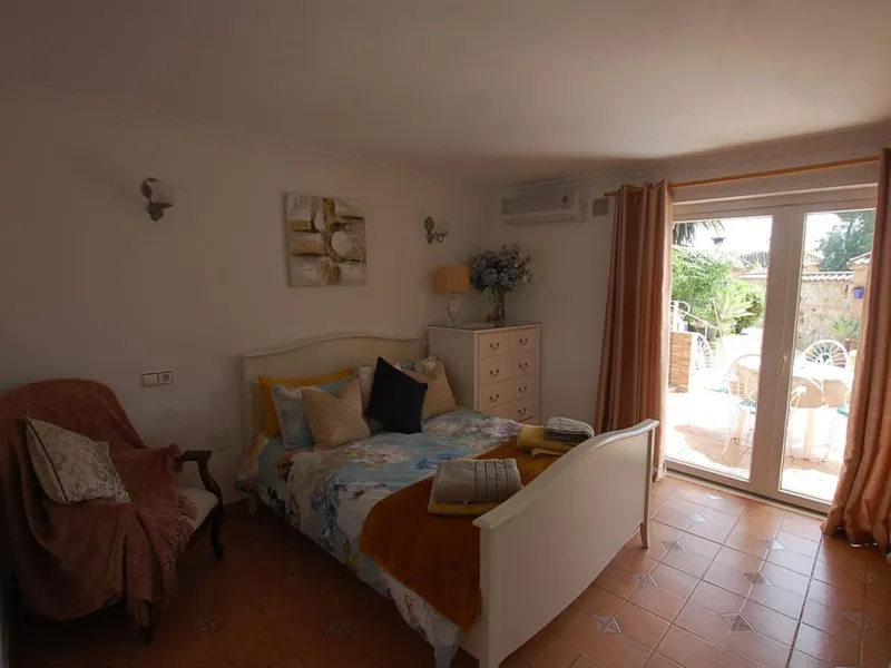 A large villa  in a quiet cul de sac in the Urbanisation of Campo Mijas with a large walled and gated garden with ample parking space for 3 or 4 cars . The property is entered via a gated entrance way to the large parking area with easy access to  the hou
