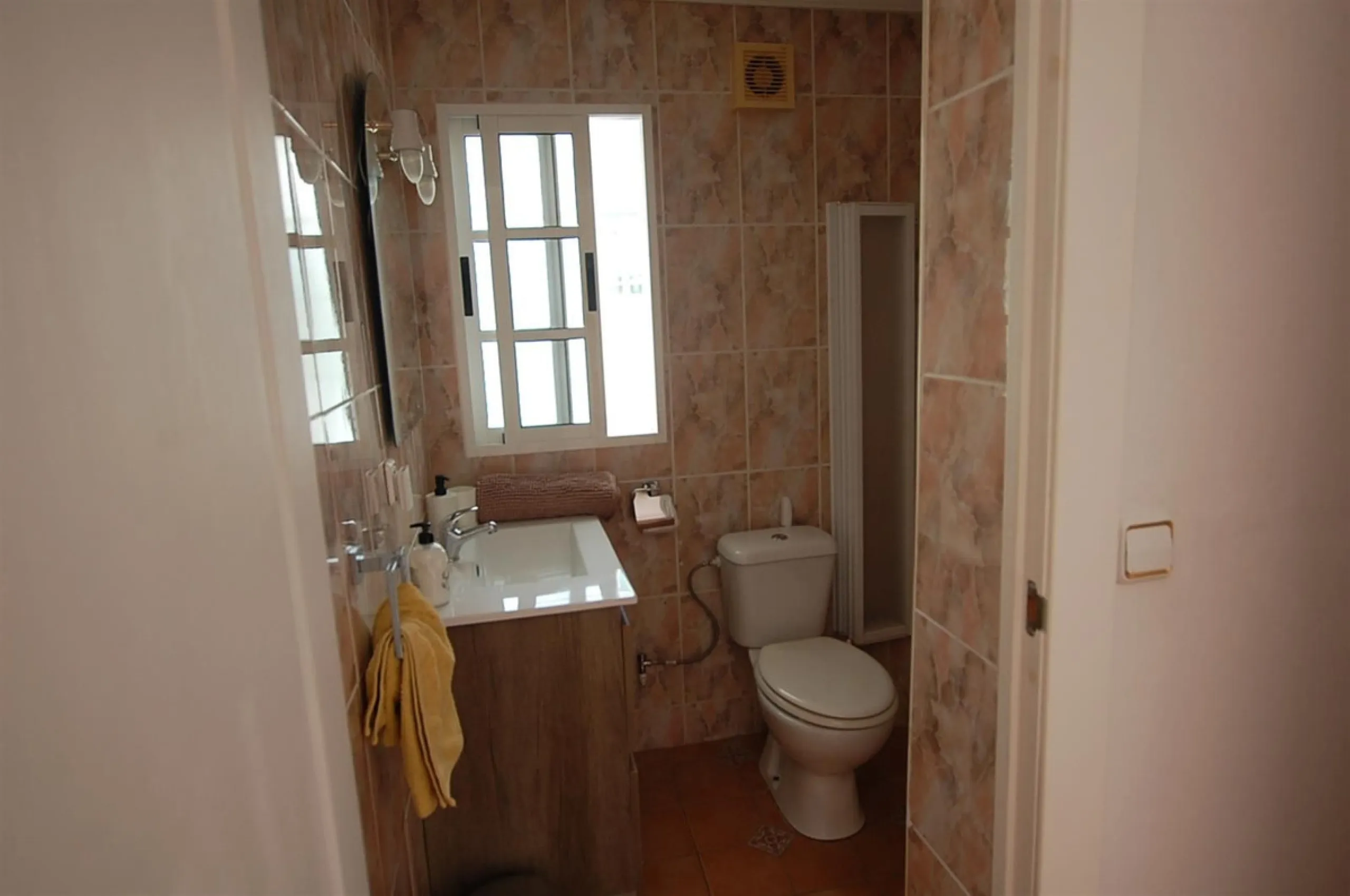 A large villa  in a quiet cul de sac in the Urbanisation of Campo Mijas with a large walled and gated garden with ample parking space for 3 or 4 cars . The property is entered via a gated entrance way to the large parking area with easy access to  the hou