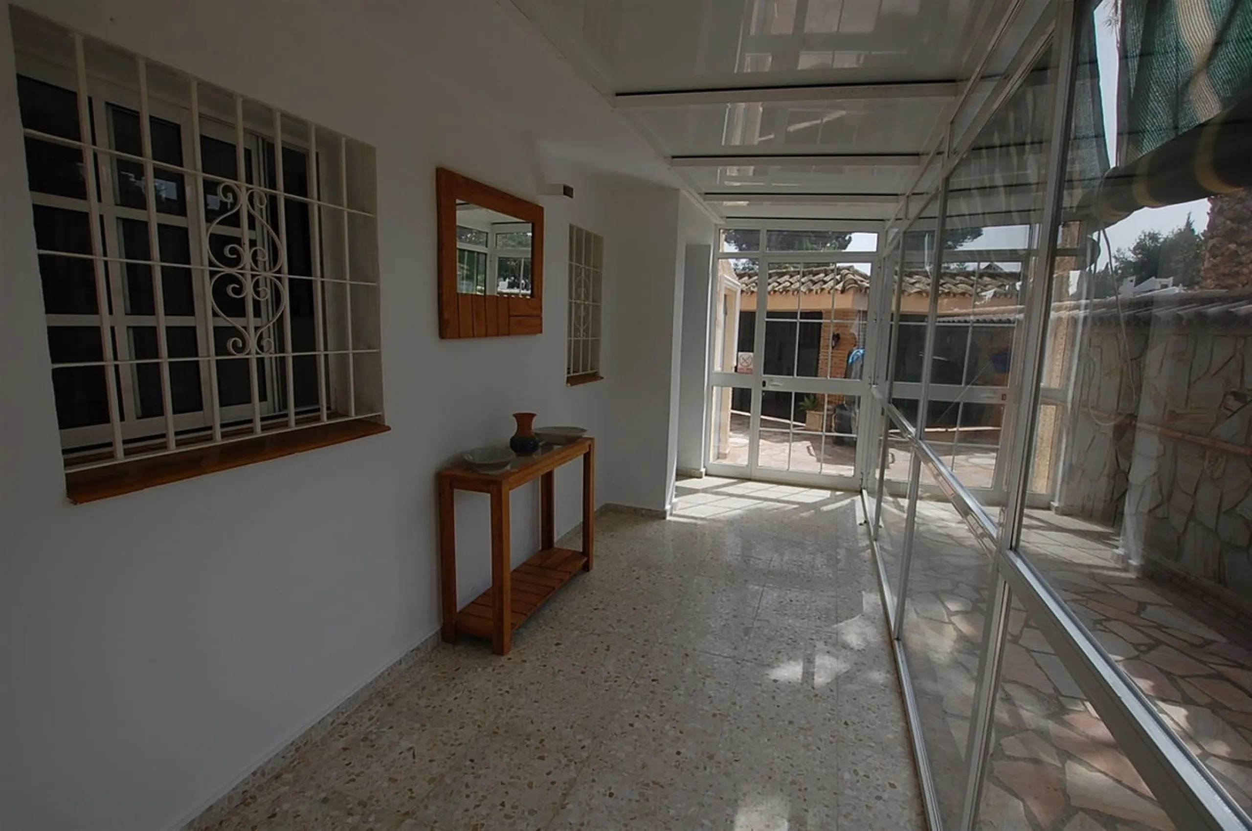 A large villa  in a quiet cul de sac in the Urbanisation of Campo Mijas with a large walled and gated garden with ample parking space for 3 or 4 cars . The property is entered via a gated entrance way to the large parking area with easy access to  the hou