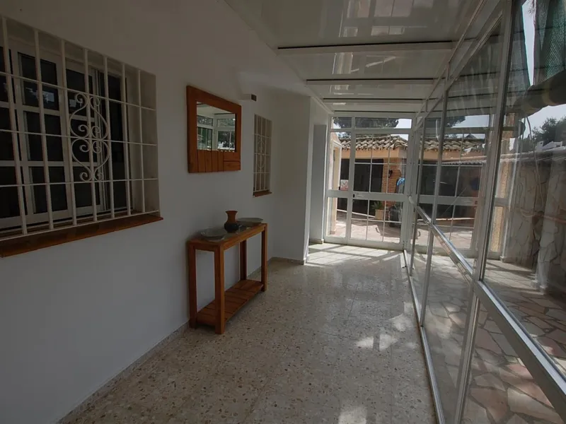 A large villa  in a quiet cul de sac in the Urbanisation of Campo Mijas with a large walled and gated garden with ample parking space for 3 or 4 cars . The property is entered via a gated entrance way to the large parking area with easy access to  the hou