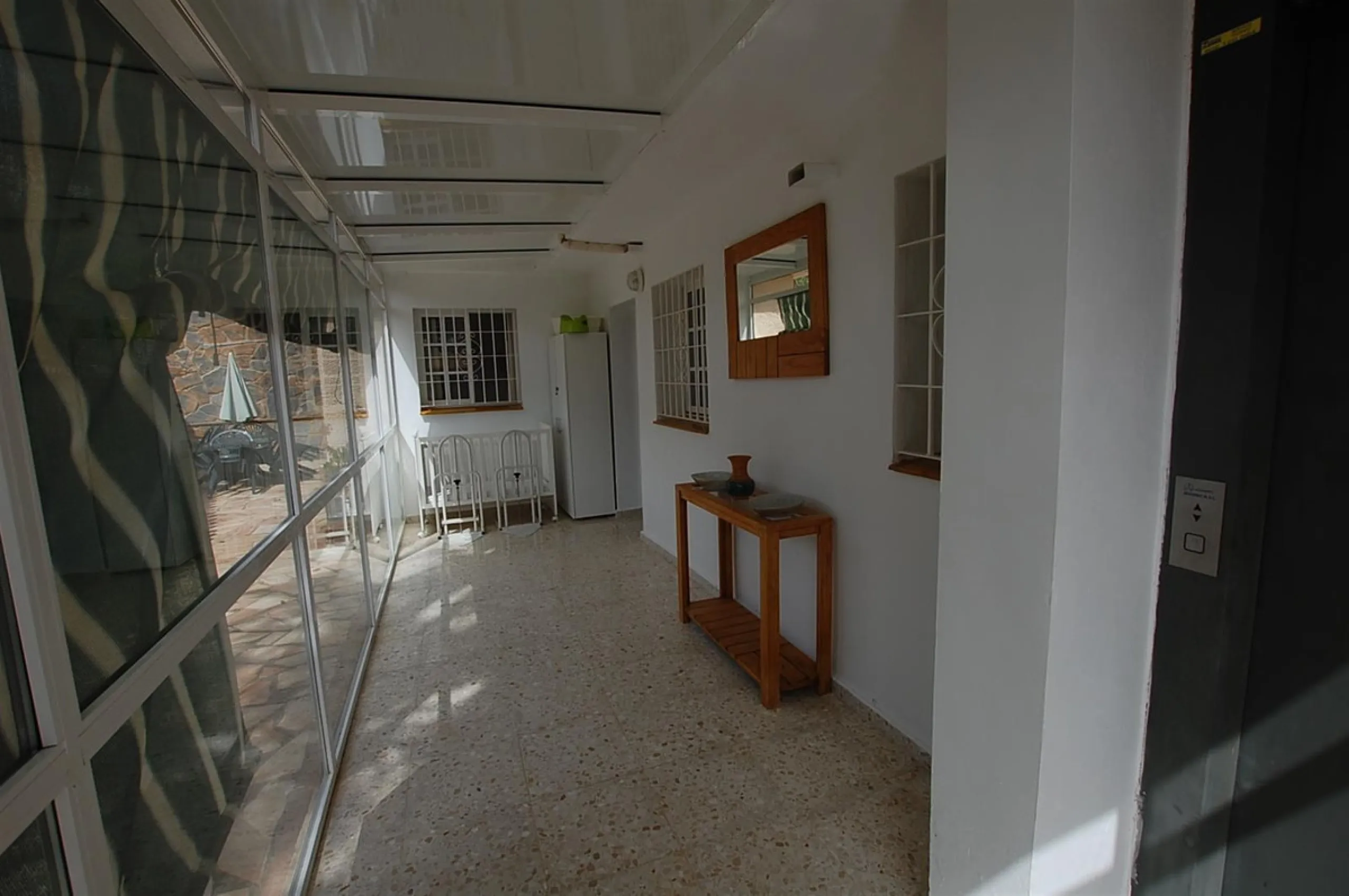 A large villa  in a quiet cul de sac in the Urbanisation of Campo Mijas with a large walled and gated garden with ample parking space for 3 or 4 cars . The property is entered via a gated entrance way to the large parking area with easy access to  the hou