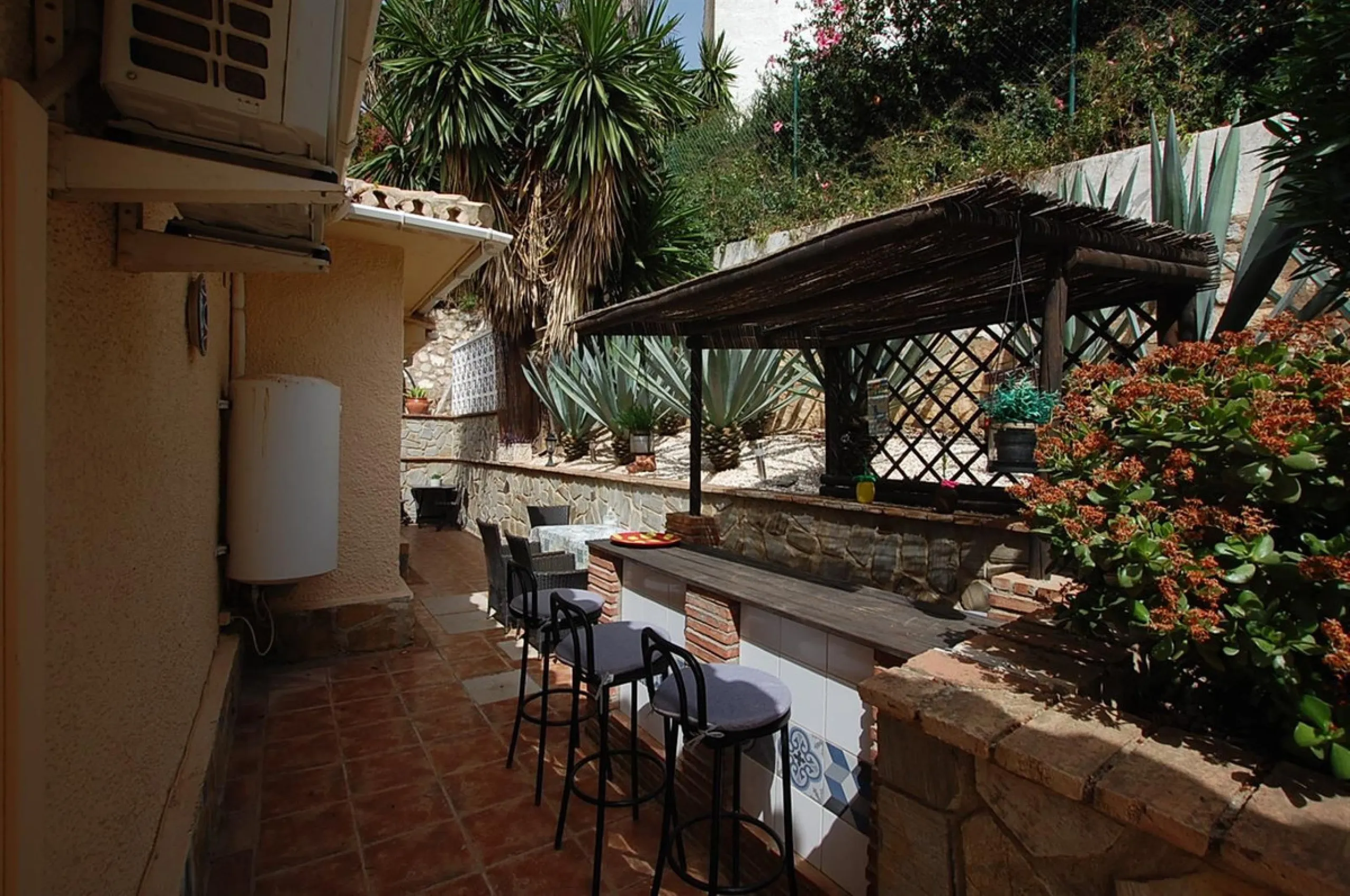 A large villa  in a quiet cul de sac in the Urbanisation of Campo Mijas with a large walled and gated garden with ample parking space for 3 or 4 cars . The property is entered via a gated entrance way to the large parking area with easy access to  the hou