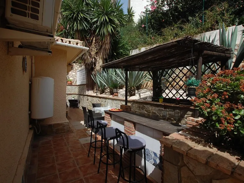 A large villa  in a quiet cul de sac in the Urbanisation of Campo Mijas with a large walled and gated garden with ample parking space for 3 or 4 cars . The property is entered via a gated entrance way to the large parking area with easy access to  the hou