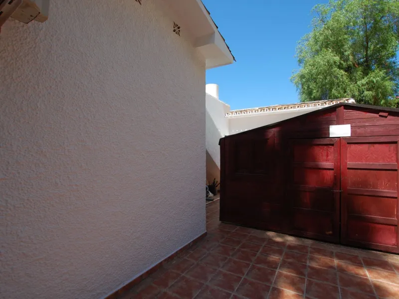 A large villa  in a quiet cul de sac in the Urbanisation of Campo Mijas with a large walled and gated garden with ample parking space for 3 or 4 cars . The property is entered via a gated entrance way to the large parking area with easy access to  the hou