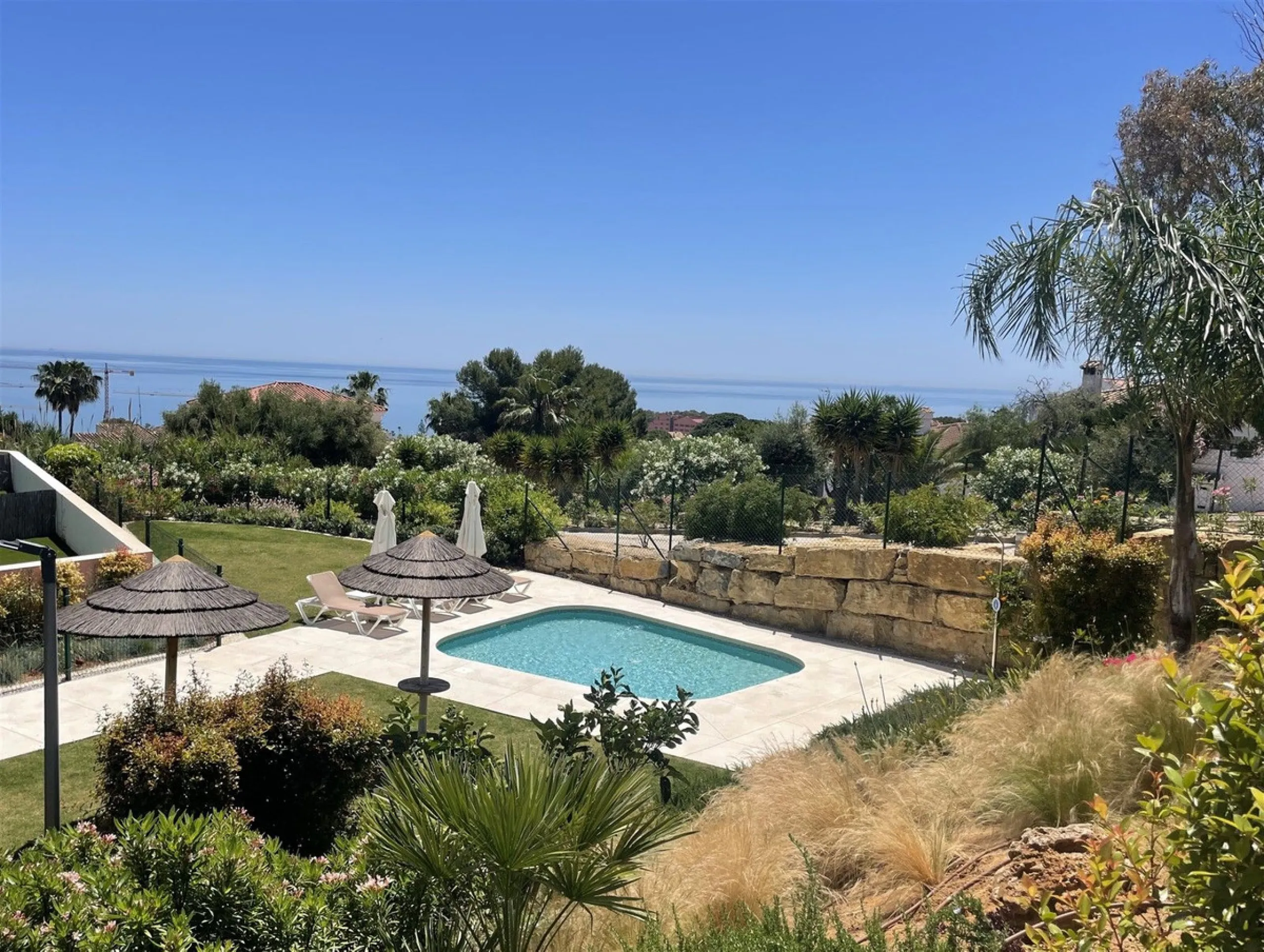 Beautiful 2 Bedroom elevated ground floor apartment with spacious terrace and sea views.
