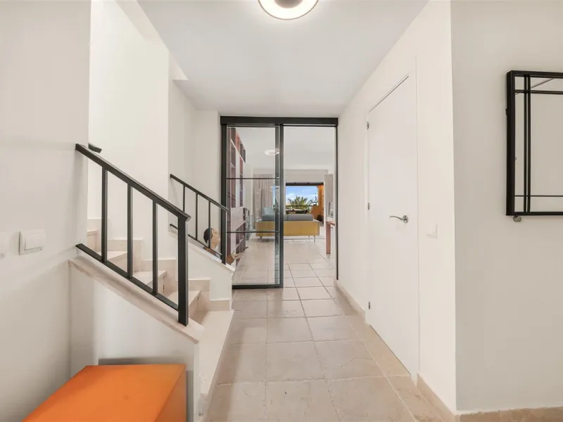 Exceptional panoramic duplex penthouse is located in the prestigious Los Flamingos Golf Resort and offers four bedrooms and two and a half bathrooms, beautifully presented in a refined modern rustic style.