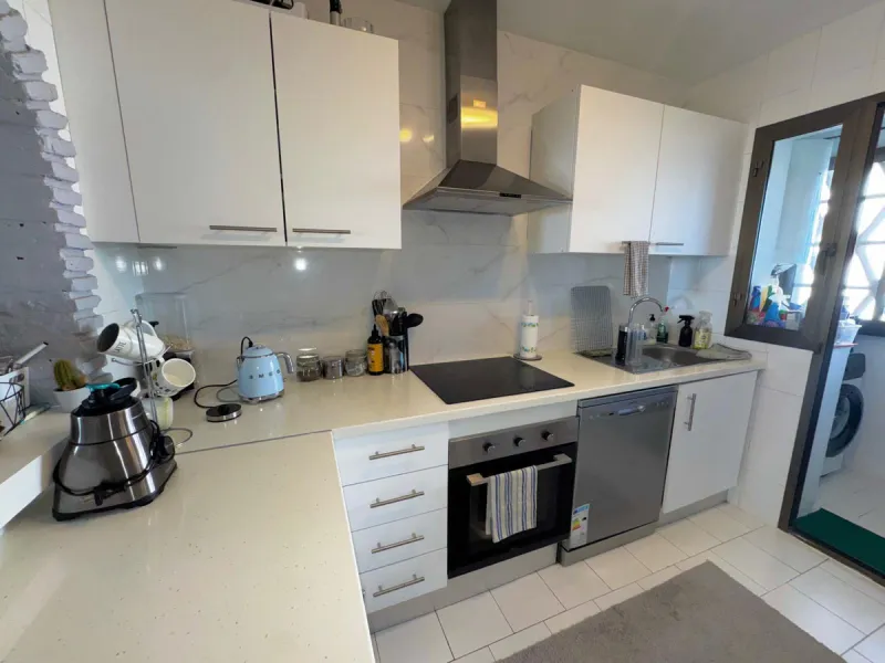 This fantastic two-bedroom, southwest-facing first-floor apartment in Calahonda offers beautiful sea views and an abundance of natural light throughout the day. The property features a bright and spacious living area complete with a charming fireplace, cr