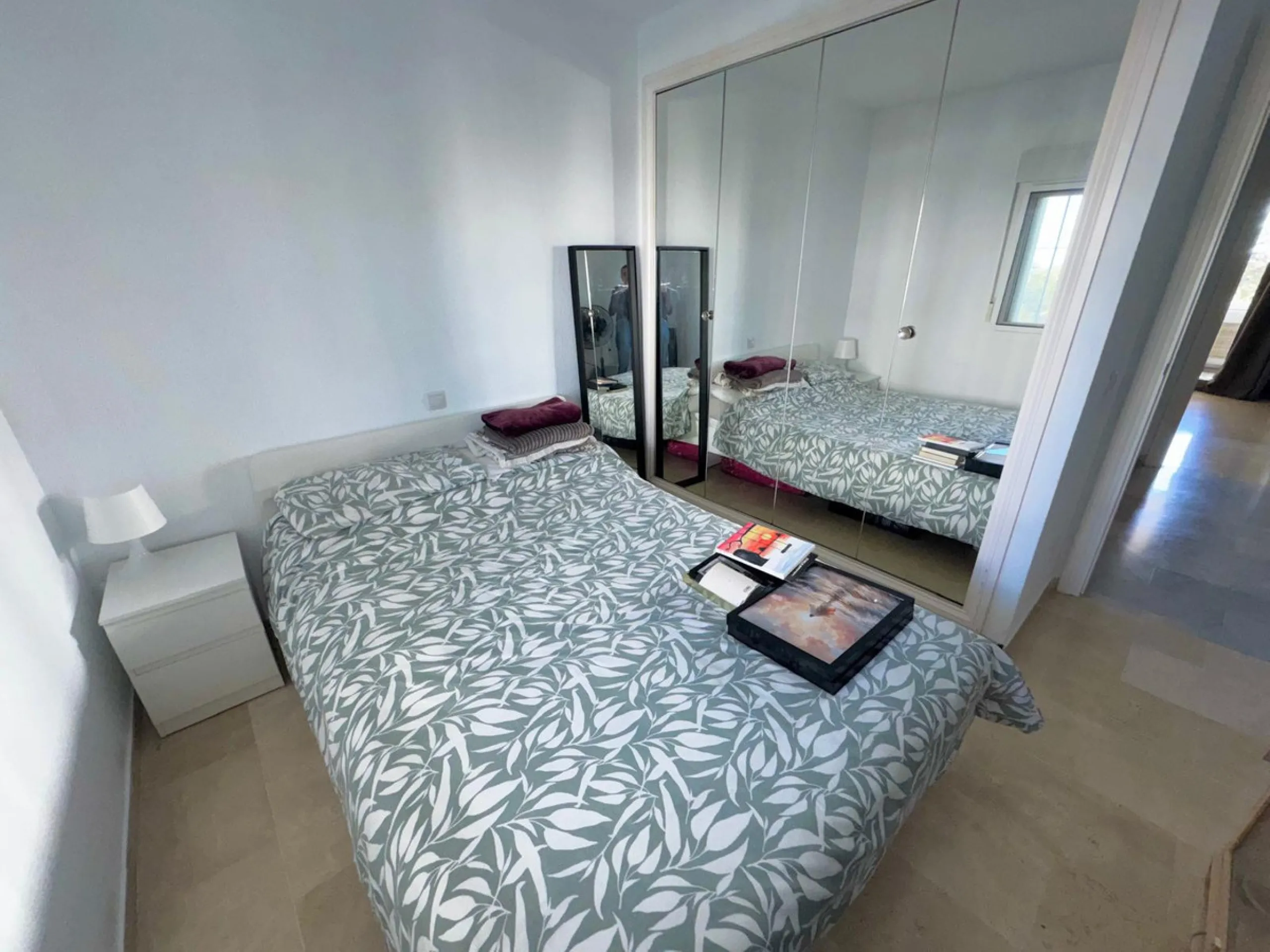 This fantastic two-bedroom, southwest-facing first-floor apartment in Calahonda offers beautiful sea views and an abundance of natural light throughout the day. The property features a bright and spacious living area complete with a charming fireplace, cr