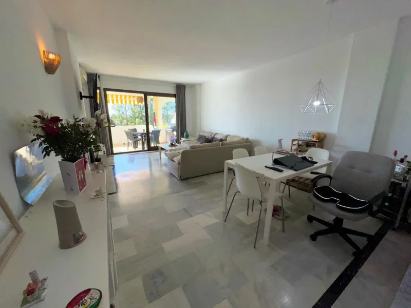 This fantastic two-bedroom, southwest-facing first-floor apartment in Calahonda offers beautiful sea views and an abundance of natural light throughout the day. The property features a bright and spacious living area complete with a charming fireplace, cr