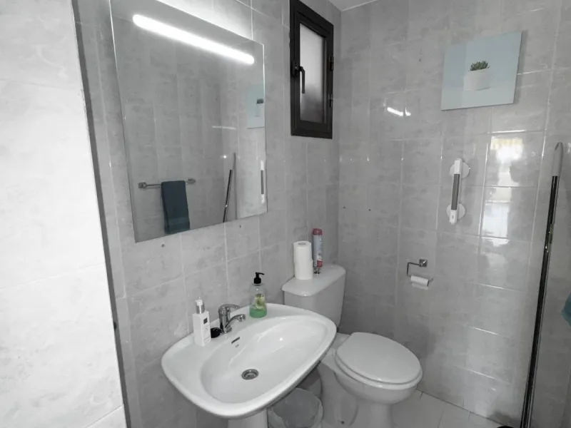 This fantastic two-bedroom, southwest-facing first-floor apartment in Calahonda offers beautiful sea views and an abundance of natural light throughout the day. The property features a bright and spacious living area complete with a charming fireplace, cr