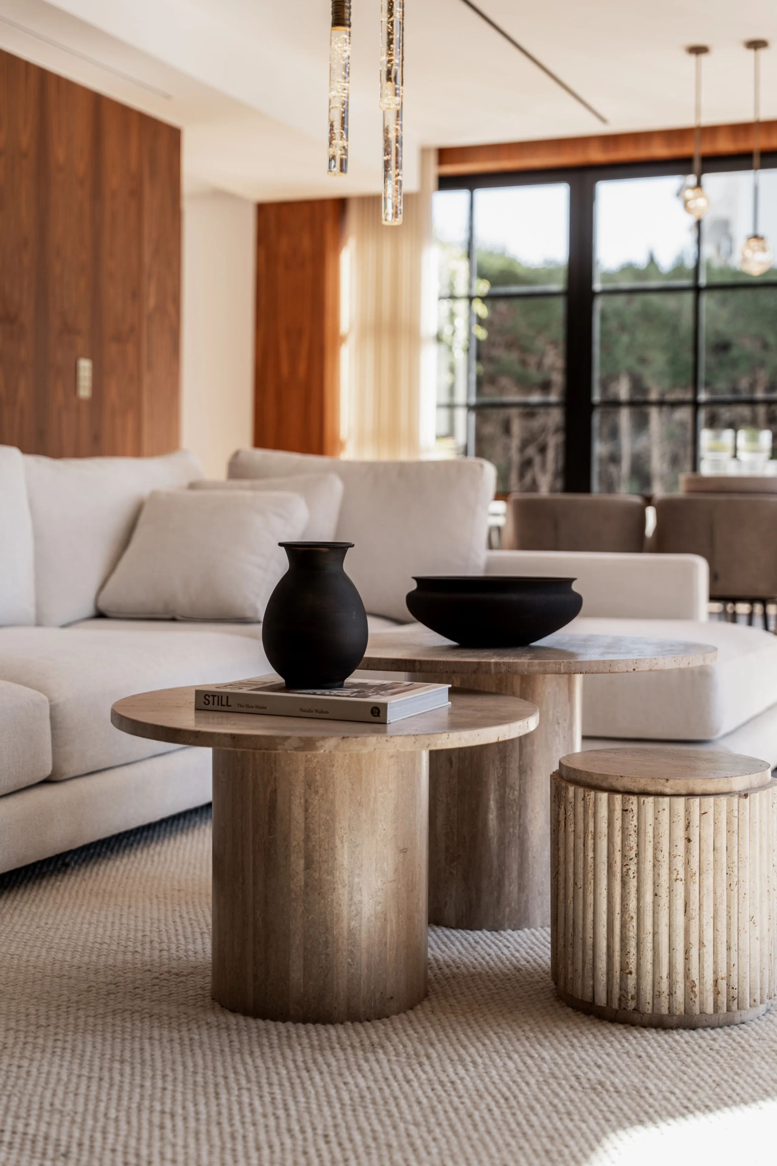 A four-bedroom villa in Nueva Andalucía with open golf and sea views, arranged over multiple levels with a garden-level pool, integrated outdoor kitchen, generous terraces and a private garage.