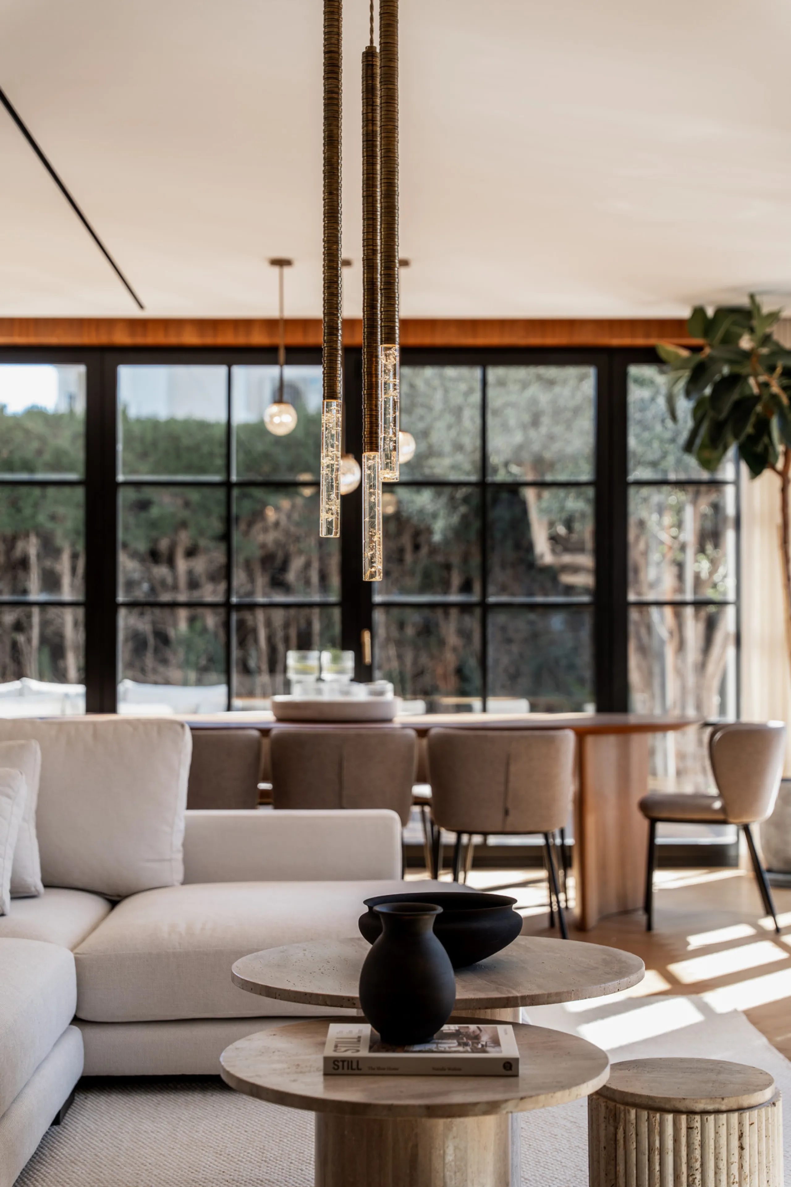 A four-bedroom villa in Nueva Andalucía with open golf and sea views, arranged over multiple levels with a garden-level pool, integrated outdoor kitchen, generous terraces and a private garage.