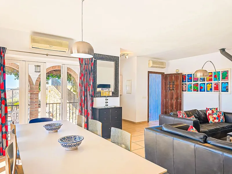 This beautiful modern villa with 5 bedrooms and 3 bathrooms enjoys an enviable elevated position above the charming white village of Cómpeta, offering sweeping views of the Mediterranean Sea, rolling countryside, and the village rooftops below. Stylish, s