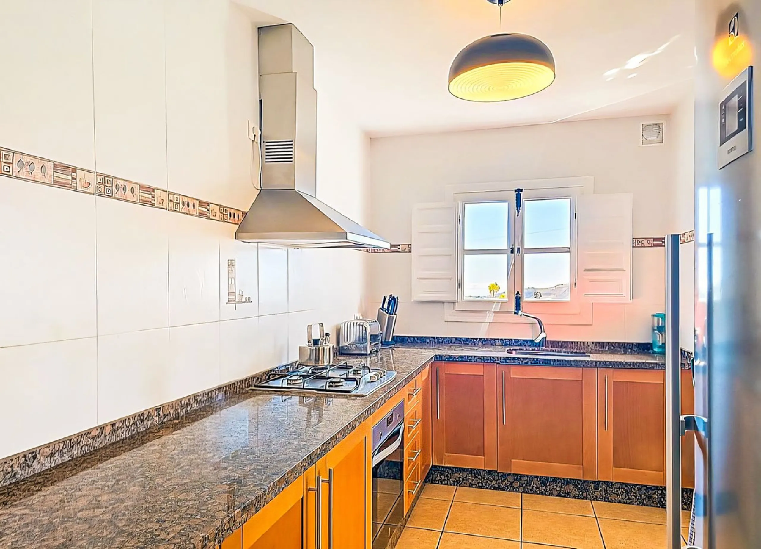 This beautiful modern villa with 5 bedrooms and 3 bathrooms enjoys an enviable elevated position above the charming white village of Cómpeta, offering sweeping views of the Mediterranean Sea, rolling countryside, and the village rooftops below. Stylish, s