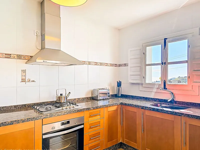 This beautiful modern villa with 5 bedrooms and 3 bathrooms enjoys an enviable elevated position above the charming white village of Cómpeta, offering sweeping views of the Mediterranean Sea, rolling countryside, and the village rooftops below. Stylish, s